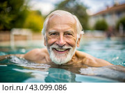 An elderly man swims and does water aerobics in a heated pool, a happy and smiling pensioner. Recreational water sports. Стоковое AI-изображение, AI-художник Photojuli / Фотобанк Лори