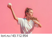 Teen girl pitching baseball. Стоковое AI-изображение, AI-художник Данил Руденко / Фотобанк Лори