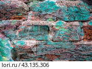 Текстура винтажной старинной кладки из красного кирпича с бирюзовой краской крупным планом. Старая кирпичная стена, фон/ Texture of a dilapidated brick wall. Стоковое фото, фотограф Iva Noel / Фотобанк Лори
