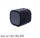 Rubberized shockproof moisture proof black portable bluetooth speaker. at the top of the control buttons are quieter and louder and also turn on and off. Стоковое фото, фотограф Дмитрий Львович Алферов / Фотобанк Лори