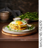 Chaffles, ketogenic diet health food. Homemade keto waffles with fried egg, mozzarella cheese. Стоковое фото, фотограф Natalia Gdovskaia / Фотобанк Лори