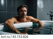 Depressed crazy man mental health in bathtub in bathroom at home looking at camera. Problem person showing human emotions. Concept apathy, anxiety, illness, trouble, creative decline. Copy space. Стоковое AI-изображение, AI-художник Aleksandr Golubev / Фотобанк Лори