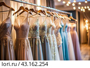 Rent dresses for evening events. Close-up. Elegant women's dresses hang on white hangers on a barbell in the salon store. Стоковое AI-изображение, AI-художник Photojuli / Фотобанк Лори