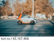 Smart Fortwo W453 Third generation Microcar manufactured by German multinational Daimler AG. Rental city car driving on the street (2021 год). Редакционное фото, фотограф Константин Григорьев / Фотобанк Лори
