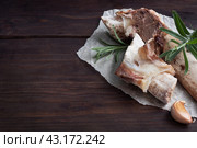 Beef bone and vegetable ingredients for cooking broth. Healthy food with collagen and amino acids. Copy space. Стоковое фото, фотограф Глущенко Елена / Фотобанк Лори