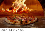 Pizza Cooking by Fire. Стоковое AI-изображение, AI-художник Юлия Гапеенко / Фотобанк Лори