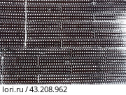 Metal texture with perforation. Snowy rusty metal fence with holes. Grunge background. Стоковое фото, фотограф Андрей Степанов / Фотобанк Лори