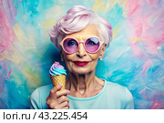 Portrait of an extraordinary, stylish, fashionable elderly woman, a pensioner of 70 years old, with glasses and ice cream in her hand. The concept of happy seniors and delicious desserts. Стоковое AI-изображение, AI-художник Photojuli / Фотобанк Лори