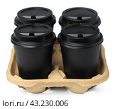 Four black takeaway cups of coffee in a tray on white background. Стоковое фото, фотограф Сергей Толмачёв / Фотобанк Лори