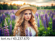 Spring flowering. Portrait of a beautiful curly-haired girl in a straw hat in a blooming field of lupines. The girl poses and looks at the camera. Стоковое AI-изображение, AI-художник Photojuli / Фотобанк Лори