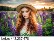 Spring flowering. Portrait of a beautiful curly-haired girl in a straw hat in a blooming field of lupines. The girl poses and looks at the camera. Стоковое AI-изображение, AI-художник Photojuli / Фотобанк Лори
