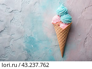 Sweet dessert. Ice cream cones with different flavors. Blue, pink, purple ice cream on a background of three pastel colors: blue, pink and purple. Стоковое AI-изображение, AI-художник Photojuli / Фотобанк Лори