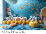 A bright and cozy children's room is decorated in the style of the underwater world. The walls of the room are decorated with drawings of corals and bright fish swimming in blue waters. In the center of the room is a soft yellow sofa, decorated with pillows in the shape of starfish and other sea creatures. A blue rug with wavy patterns imitates the seabed, adding depth and texture to the interior. In the corner of the room there is a small alcove with a crib surrounded by soft toys. The abundance of soft and cozy details creates an atmosphere of comfort and joy for children. Стоковое AI-изображение, AI-художник Анна Кривицкая / Фотобанк Лори