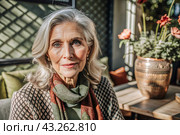 Minimalism. A studio portrait of a stylish, elegant elderly woman, a pensioner of 70 years old, in an interior and clothes of calm tones. The concept of the elderly. Стоковое AI-изображение, AI-художник Photojuli / Фотобанк Лори
