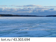 Photography of Spring day in Russian countryside. White with blue snow covering river. Concept of the beauty in nature. Стоковое фото, фотограф YuryKara / Фотобанк Лори