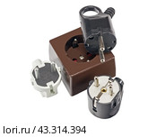 Электрическая розетка и электрические вилки на белом фоне. Electrical plug and electric socket on white background. Стоковое фото, фотограф Татьяна Д / Фотобанк Лори