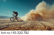 Mountain Biker Riding Through Desert Sand. Стоковое AI-изображение, AI-художник Юлия Гапеенко / Фотобанк Лори