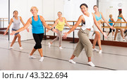 Group of active women practicing energetic dance in a studio. Стоковое фото, фотограф Яков Филимонов / Фотобанк Лори