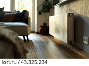 Electric Heater with Thermostat. Thermostatic Valve Temperature on a Radiator. Close-Up. Save Energy. Cost Price Hike. Smart Heater Convector. Central Heating. Storage Heaters Heating Home Electricity. Стоковое AI-изображение, AI-художник Марина Демидюк / Фотобанк Лори