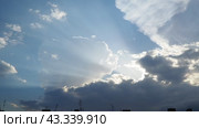 Beautiful clouds in sky. Volumetric light cumulus effect. The sunrays are hidden behind dark clouds. Convection in troposphere. Movement of moisture in atmosphere. Real time. Weather forecast. Стоковое видео, видеограф Юлия Петровская / Фотобанк Лори