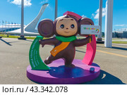 Sochi, Russia - June 10, 2024: Sochi Olympic Park. Federal Territory Sirius. Cheburashka invites to World Youth Festival 2024. Singing fountain. Adler and Sochi landmark, tourists destination. Редакционное фото, фотограф Елена Серебрякова / Фотобанк Лори