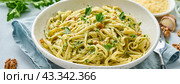 Banner with pesto pasta, bavette with walnuts, parsley, garlic, nuts, olive oil. Стоковое фото, фотограф Natalia Gdovskaia / Фотобанк Лори