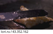 A series of closeup images capturing the process of cooking a fried egg on a hot griddle. Стоковое видео, видеограф Victor Kaprov / Фотобанк Лори