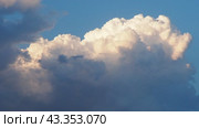 Beautiful yellow clouds in sky. Volumetric light effect. Sunrays are hidden behind approaching dark clouds. Cumulus convection in troposphere. Cumulonimbus vertical developed. Sunset and sunrays. Стоковое видео, видеограф Юлия Петровская / Фотобанк Лори