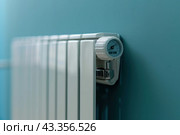 Electric Heater with Thermostat. Thermostatic Valve Temperature on a Radiator. Close-Up. Save Energy. Cost Price Hike. Smart Heater Convector. Central Heating. Storage Heaters Heating Home Electricity. Стоковое AI-изображение, AI-художник Марина Демидюк / Фотобанк Лори