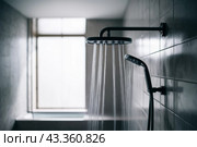 A shower head with water flowing from it in a bathroom, AI. Стоковое AI-изображение, AI-художник Сергей Старуш / Фотобанк Лори