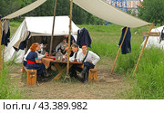 Historical reconstruction in beautiful historical and authentic costumes at festival Times and Epochs in Moscow. Life Guard of Ural Cossack Hundred (2024 год). Редакционное фото, фотограф Валерия Попова / Фотобанк Лори