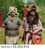 Roman Legion commanders stand in a row in ammunition and with shields, historical reconstruction . The Times and Epochs Festival 2024 - Moscow, Russia, June 16, 2024. Редакционное фото, фотограф Андрей Журавлев / Фотобанк Лори