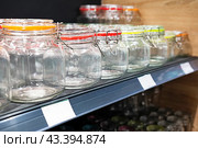 Neatly organized labeled food pantry in a home kitchen with spices grains flour rice sugar nuts. Стоковое фото, фотограф Вербицкая Светлана / Фотобанк Лори