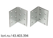 Металлический крепежный угольник на белом фоне. Metallic angle fixator on white background. Стоковое фото, фотограф Татьяна Д / Фотобанк Лори