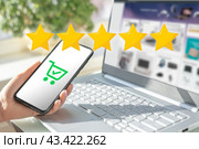 Woman hands evaluate product purchased online. rating to the seller. five star rating. Rise on increasing five stars in human hand, Increase rating evaluation classification concept. Стоковое фото, фотограф Павел Муравьев / Фотобанк Лори