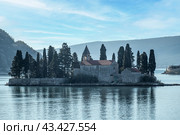 Island and Church of Our Lady on the reef and the Island of St. George in the Bay of Kotor. St George Island in the Bay of Kotor at Perast in Montenegro, with St George Benedictine Monastery (2021 год). Стоковое фото, фотограф Павел Муравьев / Фотобанк Лори