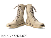 Boots with high lacing. winter beige women's boots with lacing. isolated on white background. comfortable winter boots for women. Стоковое фото, фотограф Павел Муравьев / Фотобанк Лори