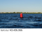 Красный бакен на тёмной синей воде, волны на реке, речной пейзаж. Стоковое фото, фотограф Андрей Цыганков / Фотобанк Лори