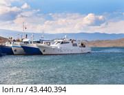 Baikal Lake in Summer. Beautiful seascape with ships on the pier in the village of Sakhyurta on a sunny day. Summer cruises and travel. Стоковое фото, фотограф Виктория Катьянова / Фотобанк Лори