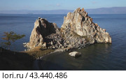 Video of Baikal Lake. Main landmark of Olkhon Island for visiting tourists is the Shamanka Rock. Beautiful autumn landscape. Natural background. Top view. Travel and outdoor recreation. Стоковое видео, видеограф Виктория Катьянова / Фотобанк Лори