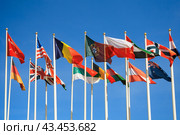 Rows of a flags of different countries of the world a background of clear blue sky. Стоковое фото, фотограф Михаил Строгалев / Фотобанк Лори