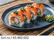 Japanese food. Sushi rolls California, Philadelphia with eel, red caviar and salmon. The concept of the sushi bar menu. Стоковое AI-изображение, AI-художник Photojuli / Фотобанк Лори