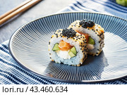 Japanese food. Sushi rolls California, Philadelphia with eel, red caviar and salmon. The concept of the sushi bar menu. Стоковое AI-изображение, AI-художник Photojuli / Фотобанк Лори