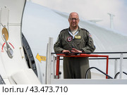 BERLIN - JUNE 06, 2024: The technician of military aircraft Boeing E-3A Sentry AWACS. ILA Berlin Air Show 2024. Редакционное фото, фотограф Sergey Kohl / Фотобанк Лори