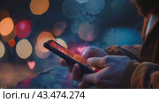 A person is holding a phone with "like", "message", "comment" and "like" notification icons floating above the smartphone screen, as well as with social networks and digital communications. Стоковое AI-видео, аниматор Терехова Марина / Фотобанк Лори