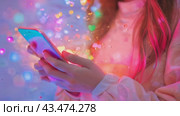 A person is holding a phone with "like", "message", "comment" and "like" notification icons floating above the smartphone screen, as well as with social networks and digital communications. Стоковое AI-видео, аниматор Терехова Марина / Фотобанк Лори