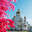 Saransk, Russia - June 5, 2023. Bolshevistskaya street in Saransk, Russia. view of the Cathedral of Theodore Ushakov against a background of bright flowers. Редакционное фото, фотограф Оксана Медведева / Фотобанк Лори