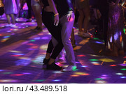 Photography of beautiful dancing people on the night party in the city street in summer night. Leisure, happiness and entertainment theme. Стоковое фото, фотограф YuryKara / Фотобанк Лори