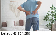 Back pain, kidney inflammation, man suffering from backache at home, health problems concept. Стоковое видео, видеограф Станислав Тарко / Фотобанк Лори