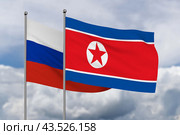 North Korea and Russian flag on sky background. 3D illustration. Стоковая иллюстрация, иллюстратор Ильин Сергей / Фотобанк Лори